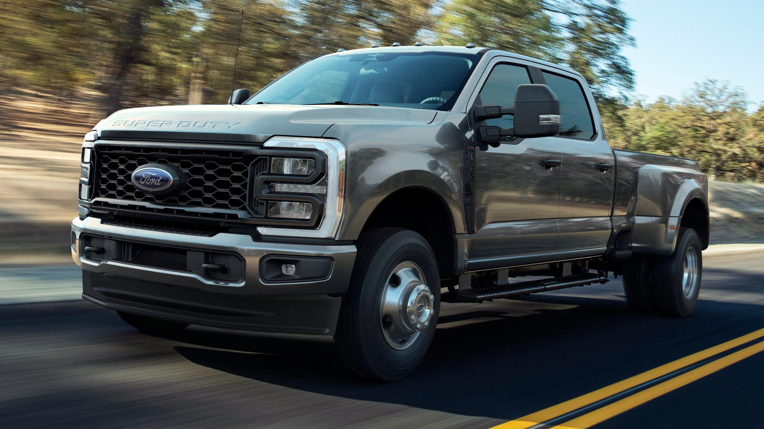 2026 Ford Super Duty® F-250® XL pickup with the STX® Appearance Package in Carbonized Gray driving on a paved road