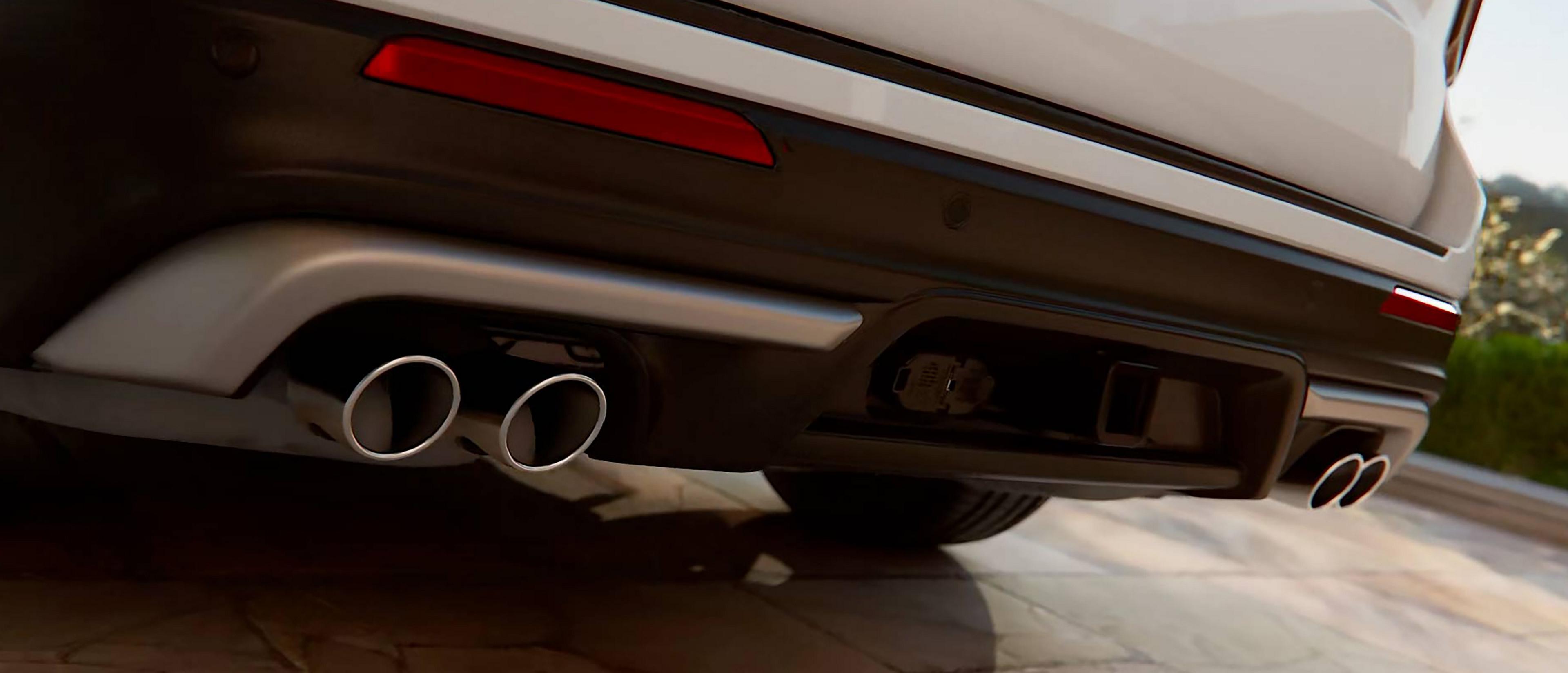 The rear of a 2027 Ford Explorer® Platinum™ SUV with available 3.0L Ultimate Package, showing the quad-tipped exhaus