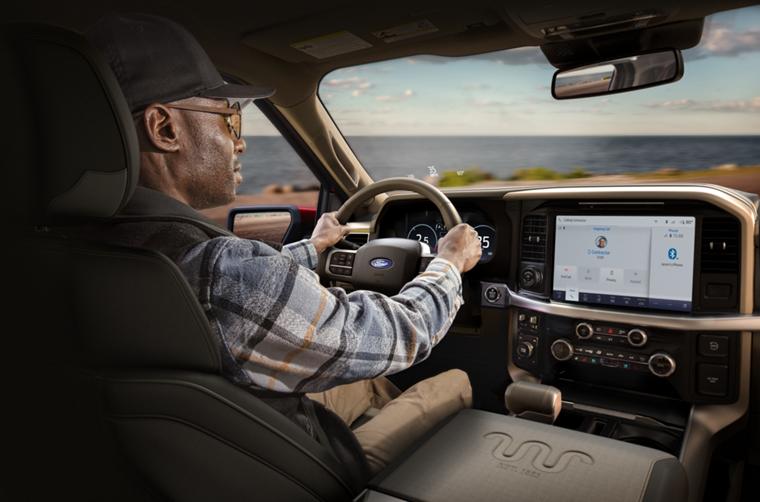 Man driving a 2026 Ford F-150® pickup showing the center display