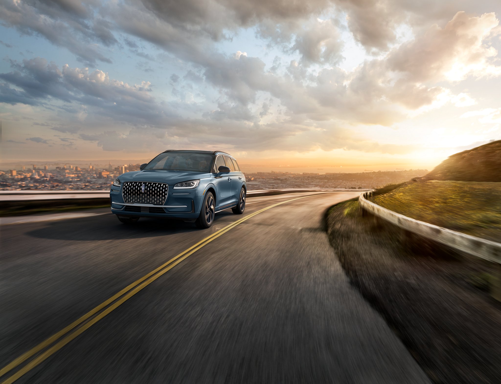 The stylish grille, unique to the 2026 Lincoln Corsair Grand Touring Plug-in Hybrid, glistens in the sunlight