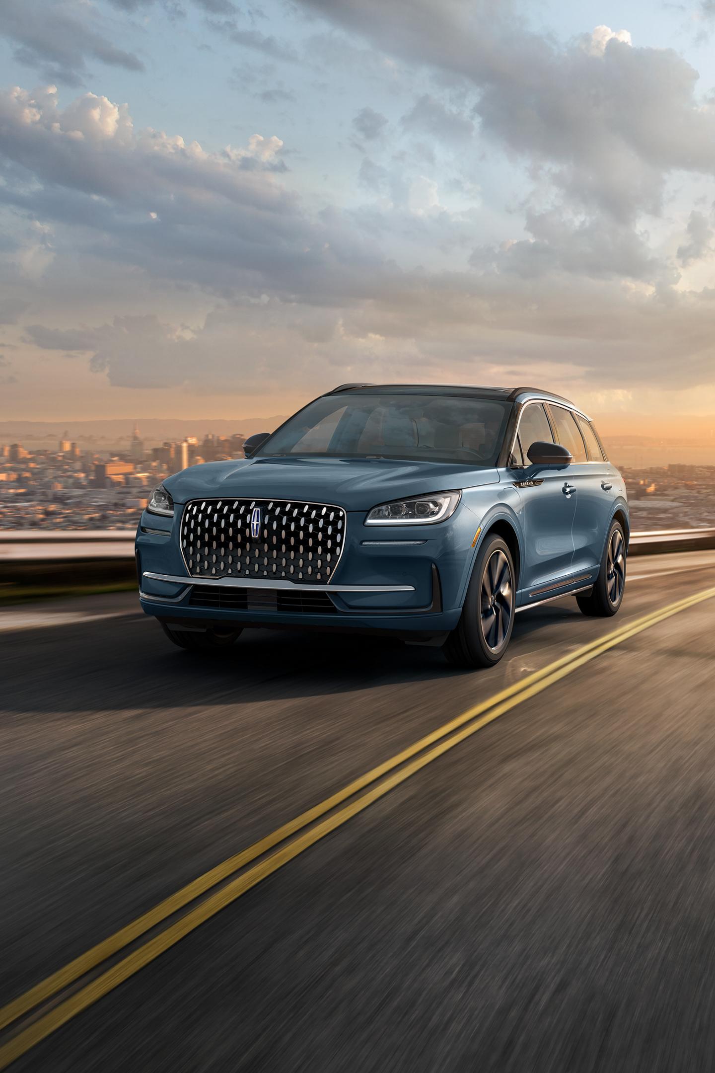 The stylish grille, unique to the 2026 Lincoln Corsair Grand Touring Plug-in Hybrid, glistens in the sunlight