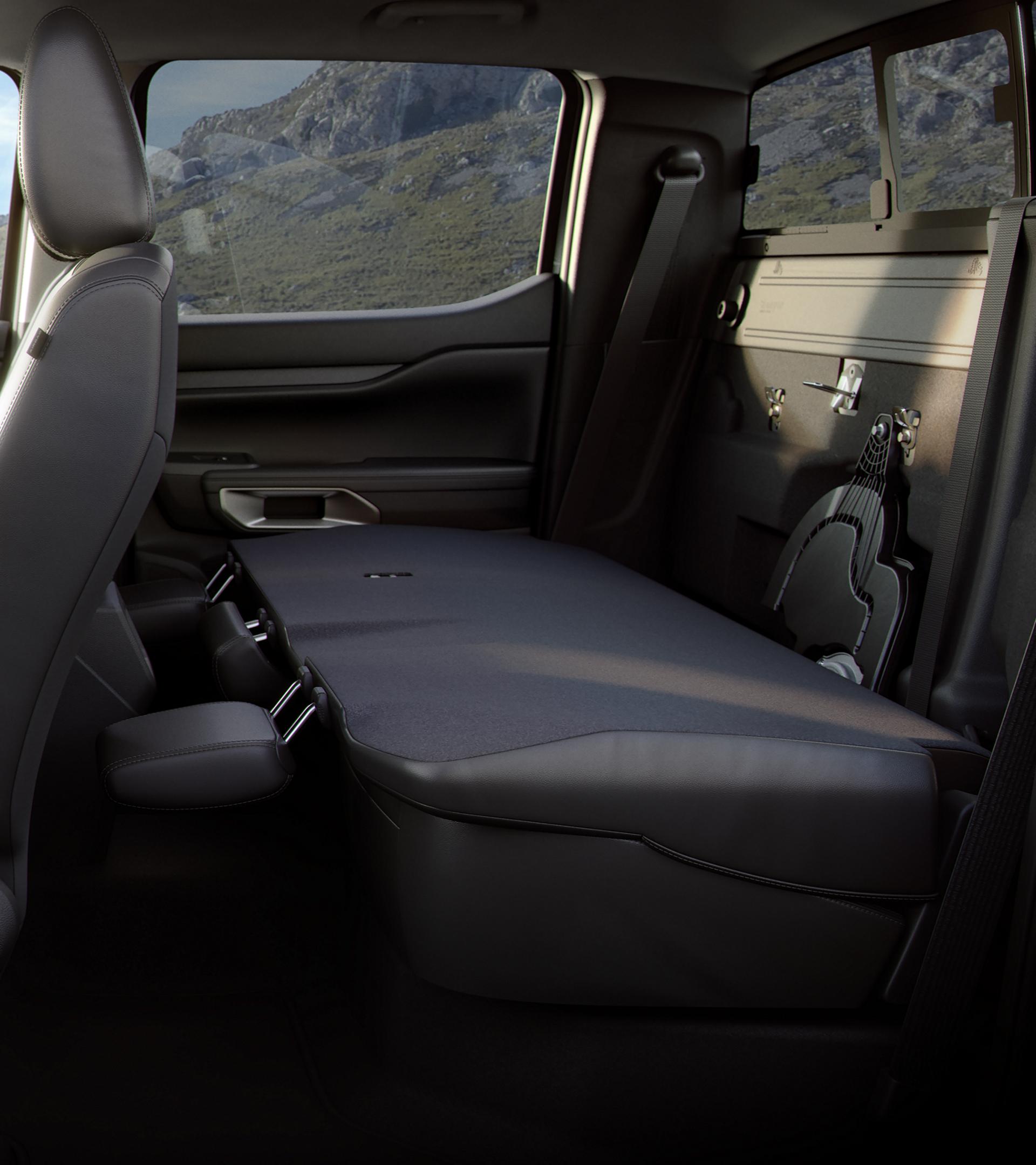 Interior shot showcasing the rear seat folded down in 2025 Ford Ranger®
