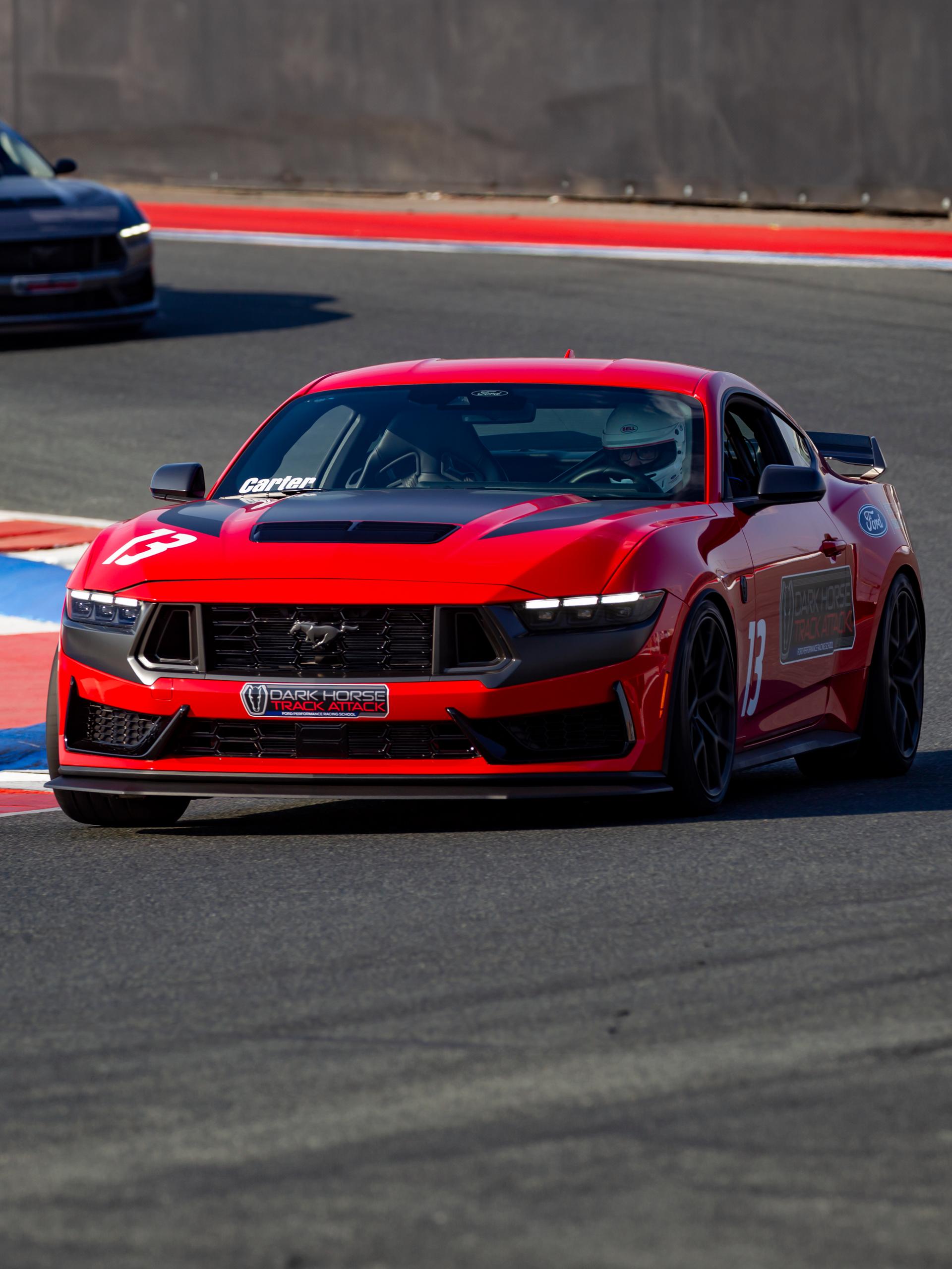 Dark Horse™ Track Attack Mustang® coupe being driven on a closed course