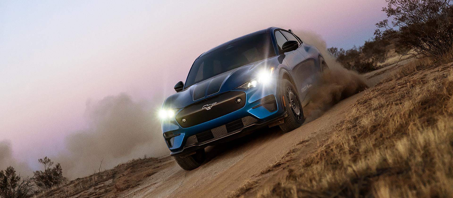 2026 Ford Mustang Mach-E® Rally model being driven on a dirt road