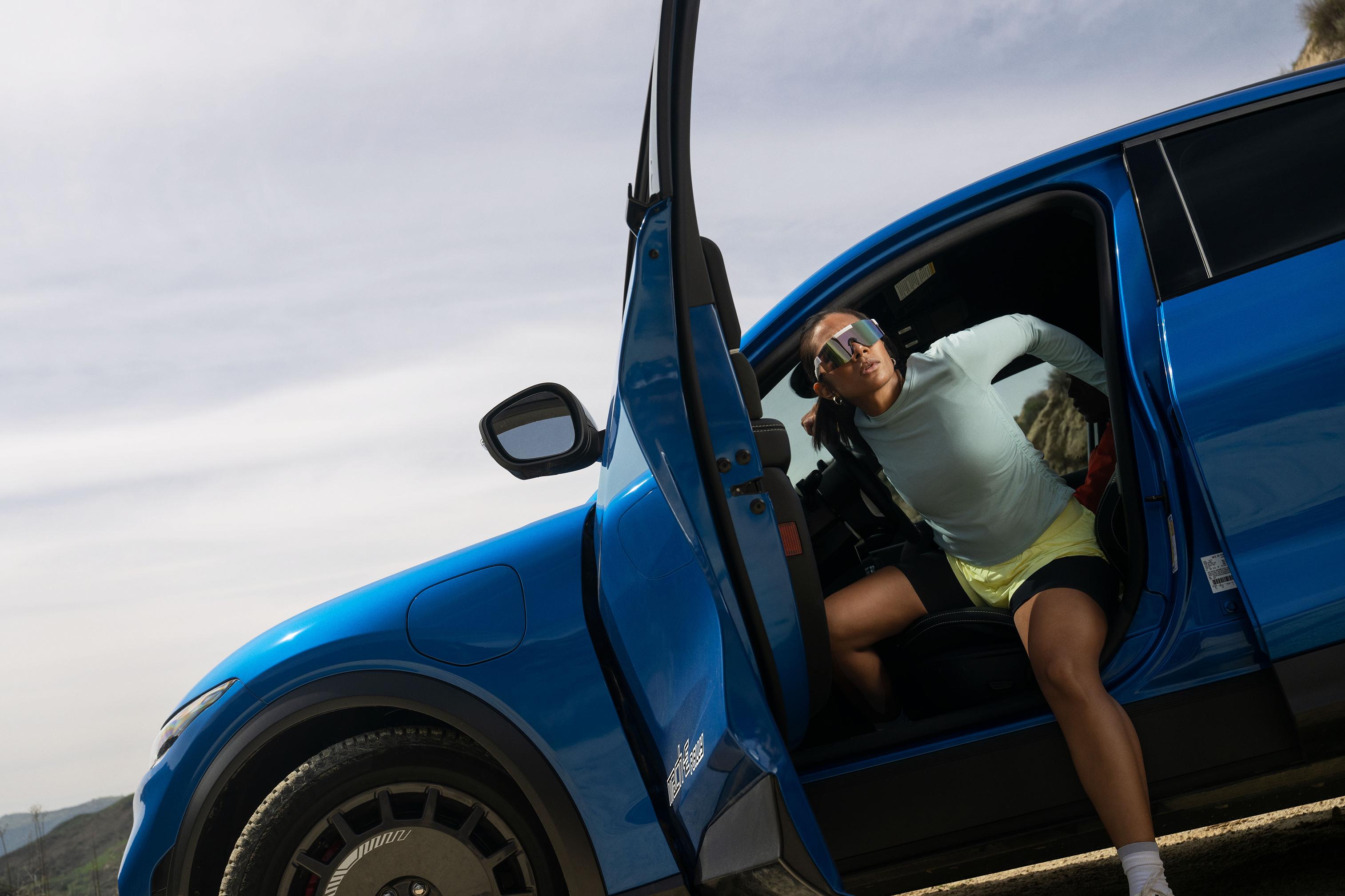 A person getting out of a 2025 Ford Mustang Mach-E® Rally