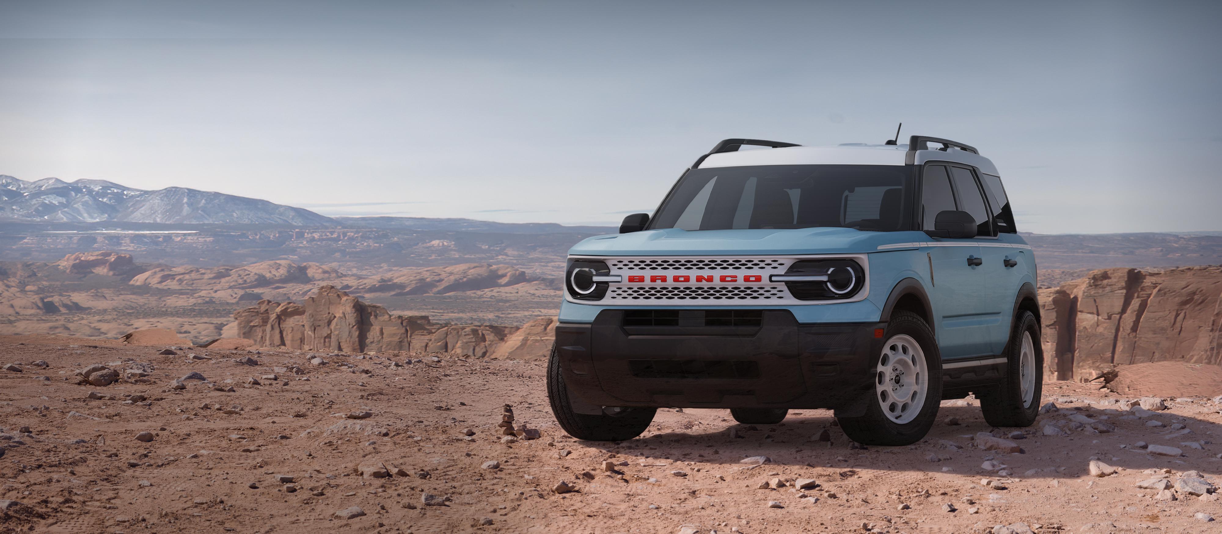 2026 Ford Bronco Sport® Heritage parked on dirt with rocky cliffs in the background