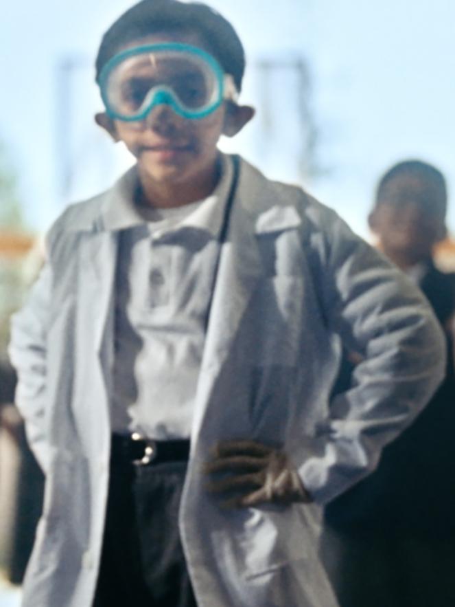Group of smiling kids lined up at school 