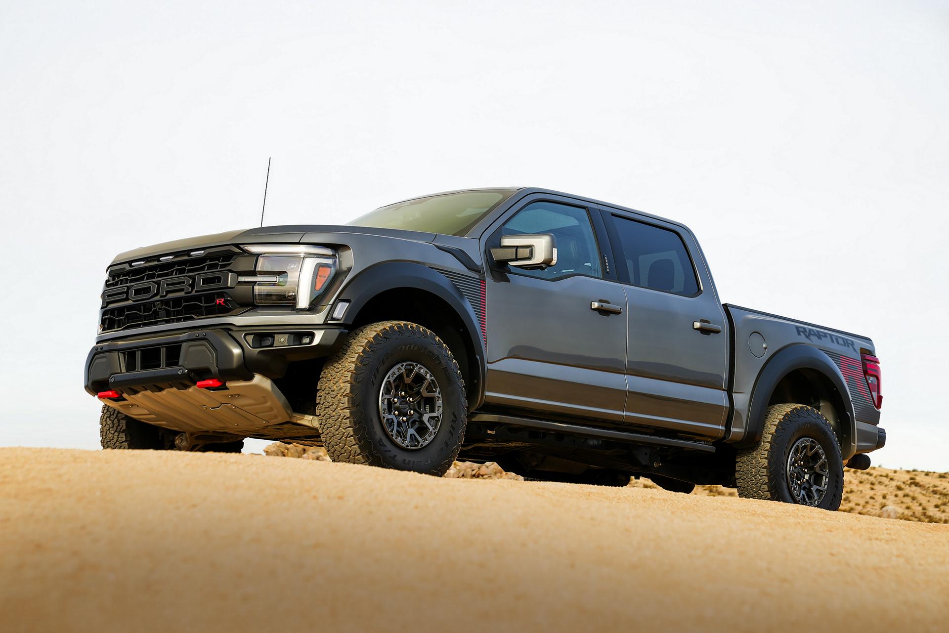 2025 Ford F-150® Raptor R™ truck in Carbonized Gray Metallic parked in the desert