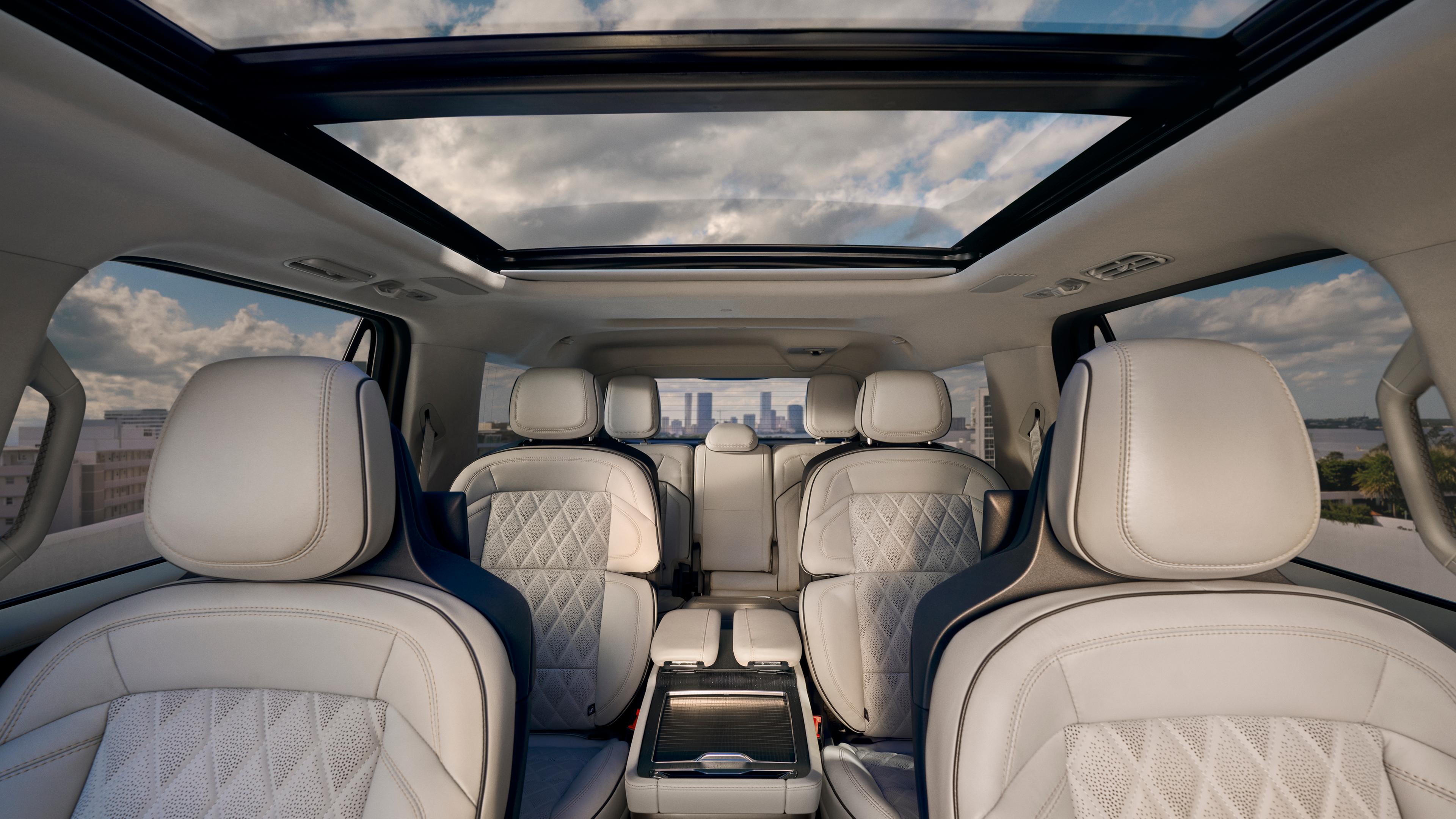 Interior of a 2026 Lincoln Black Label Navigator® shown looking through the cabin with the open Panoramic Vista roof above
