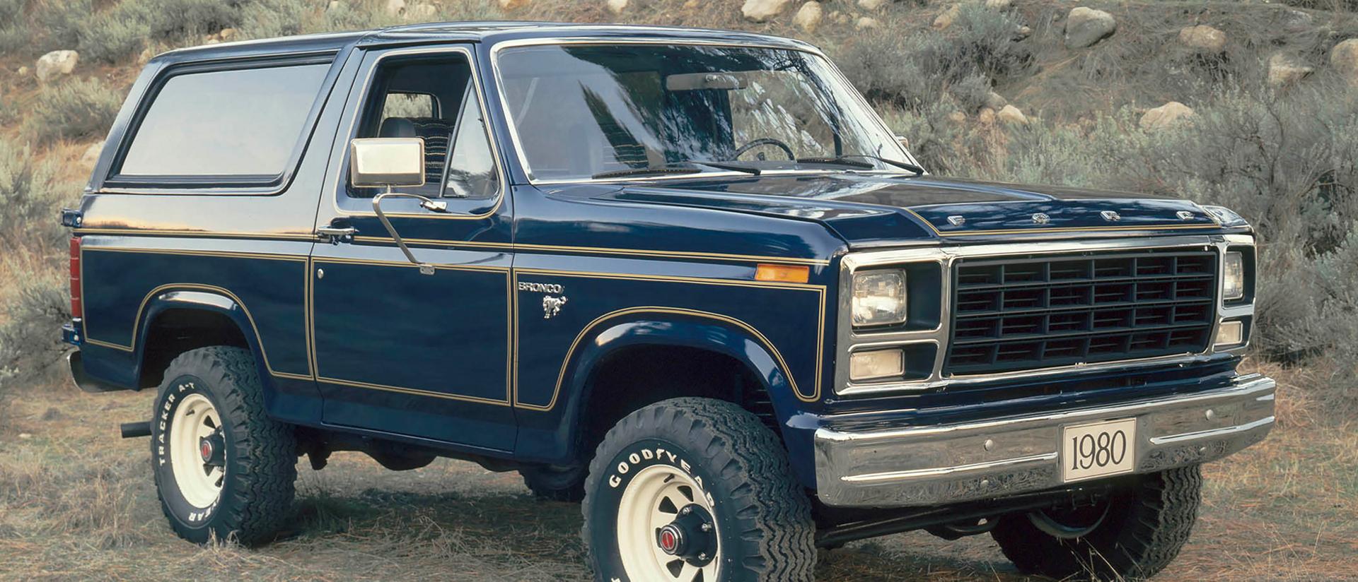 A blue 1980 Ford Bronco® model parked on a rocky trial