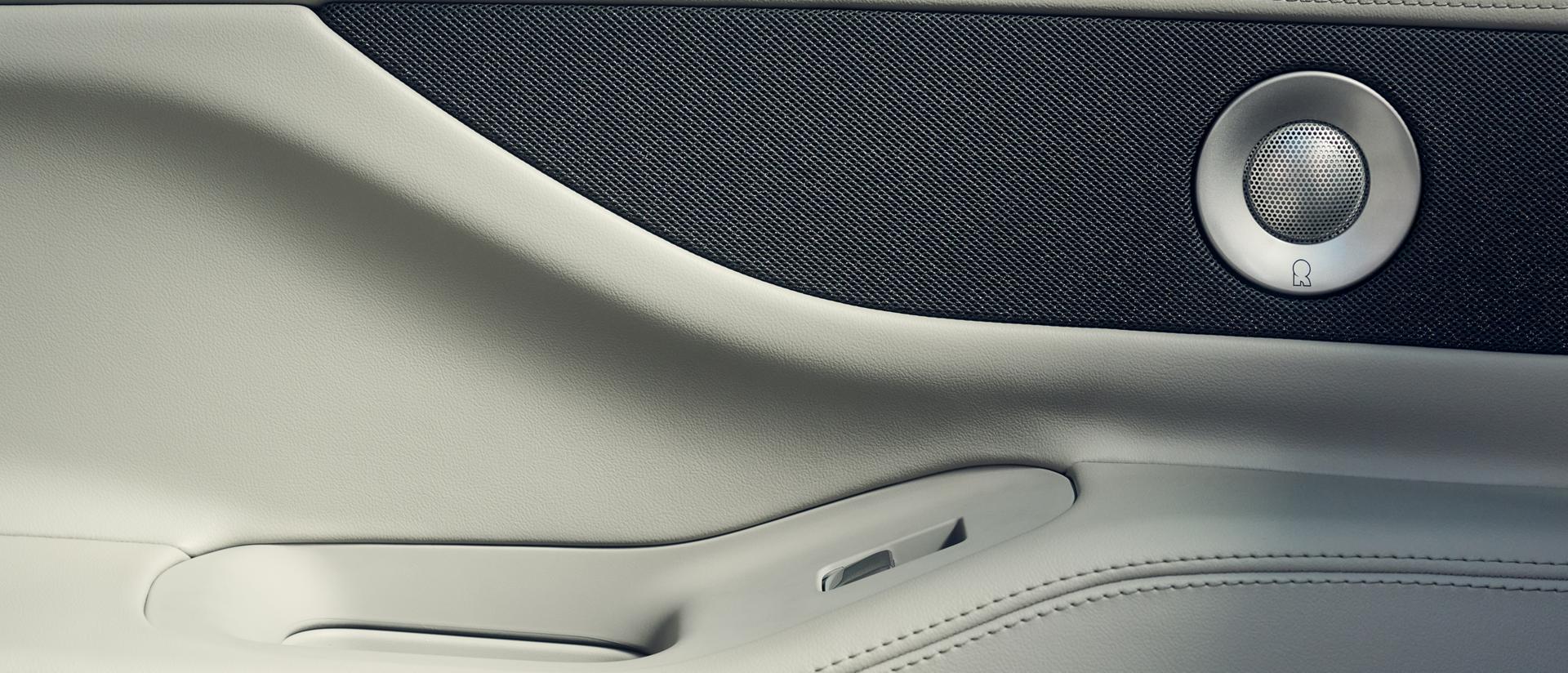 Revel® Ultima speakers are shown in the driver's door of a 2026 Lincoln Navigator® SUV