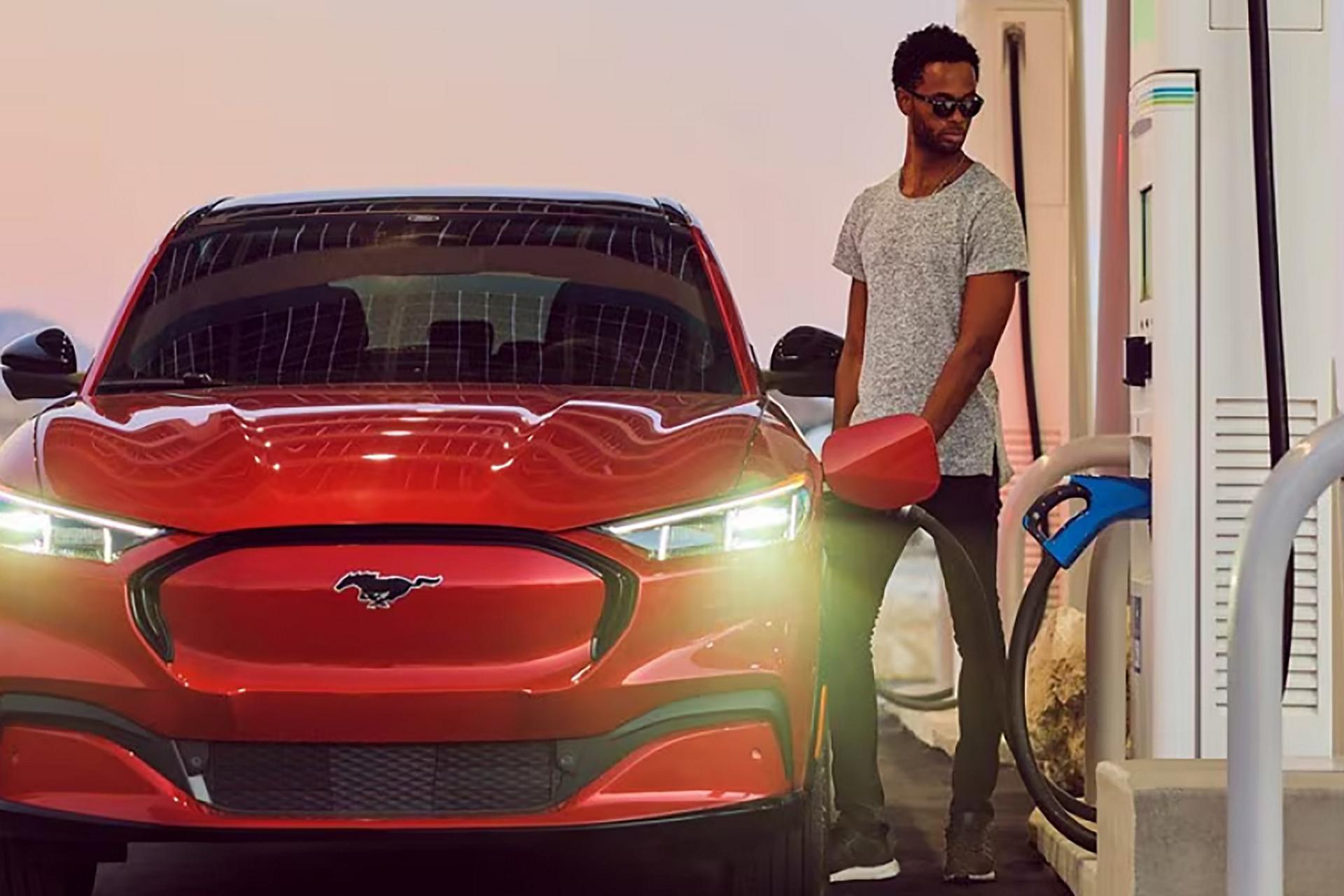 A Ford Mustang Mach-E® SUV is parked at a public charger