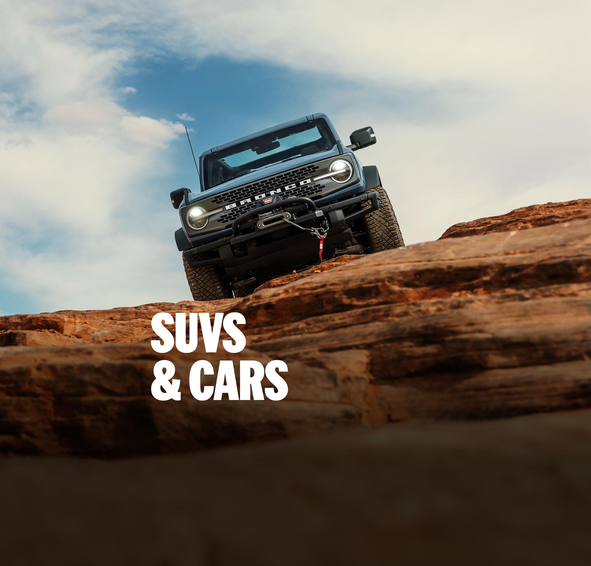 The Ford Bronco® and Expedition® SUVs being driven out on the trail
