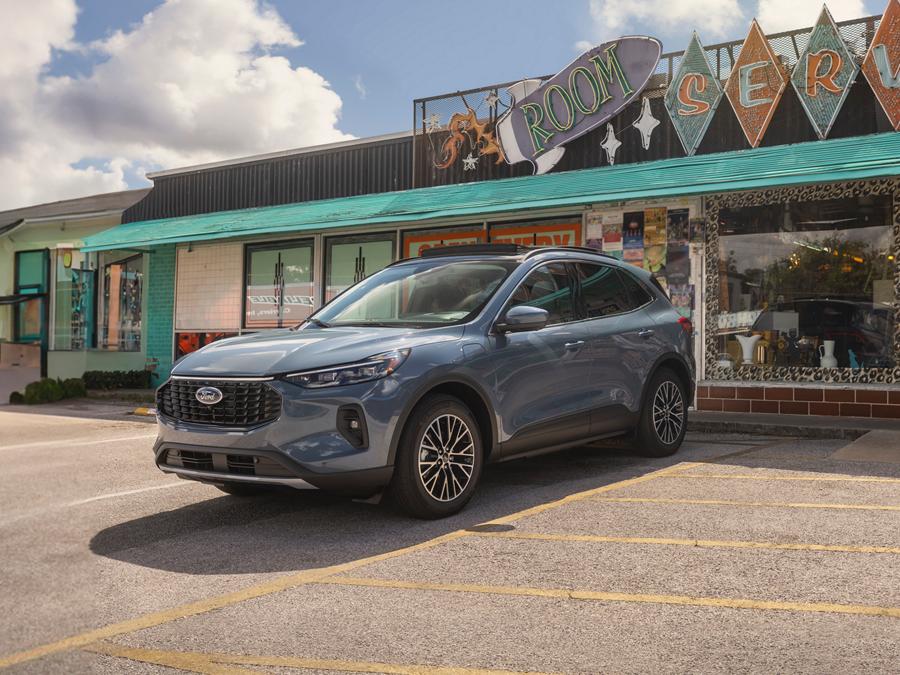 2026 Ford Escape® SUV parked in reverse outside a strip mall