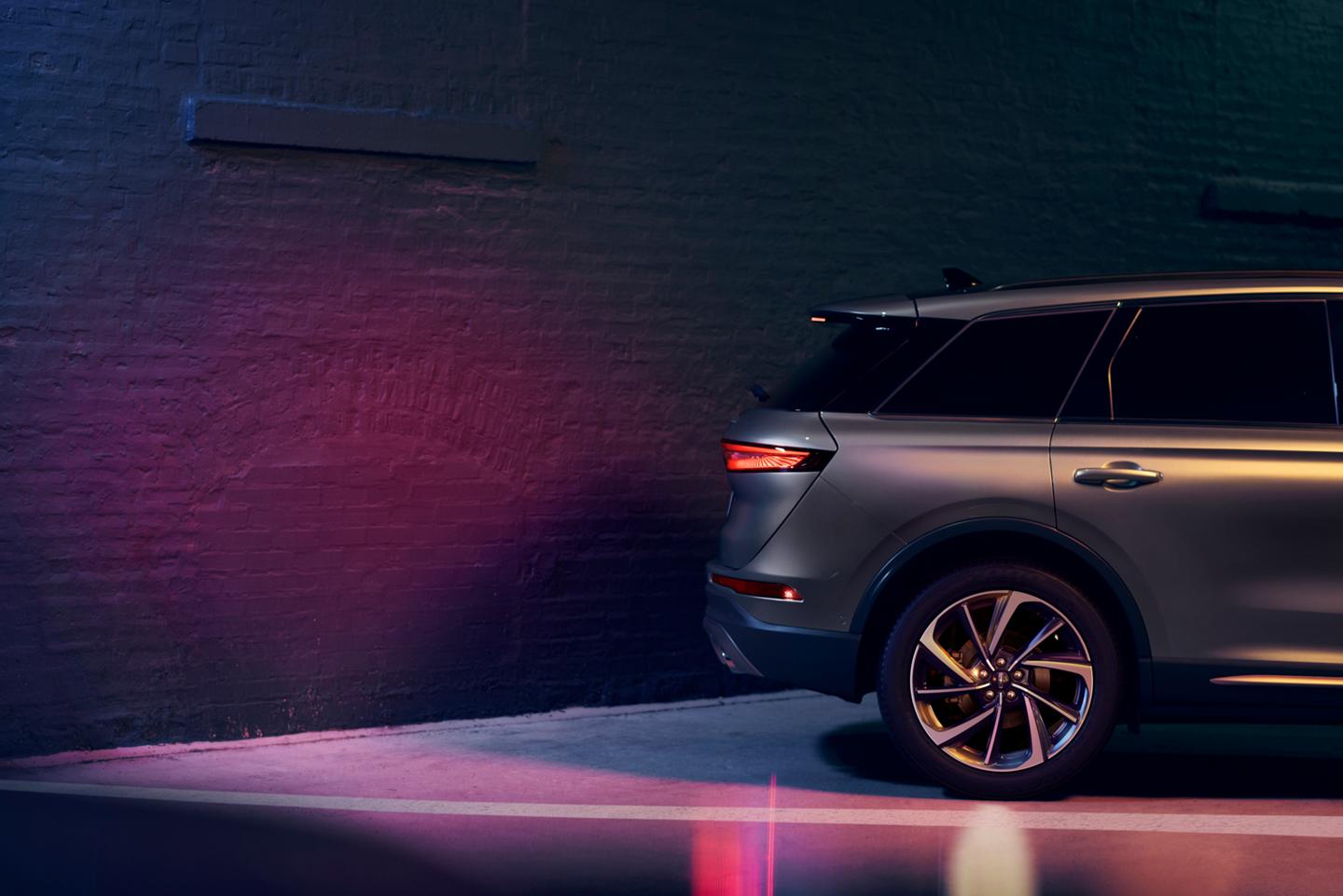 A 2025 Lincoln Corsair® SUV uses Reverse Brake Assist as it backs up toward a wall