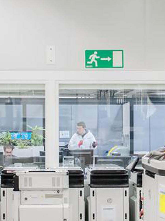 3D printers lined up in room