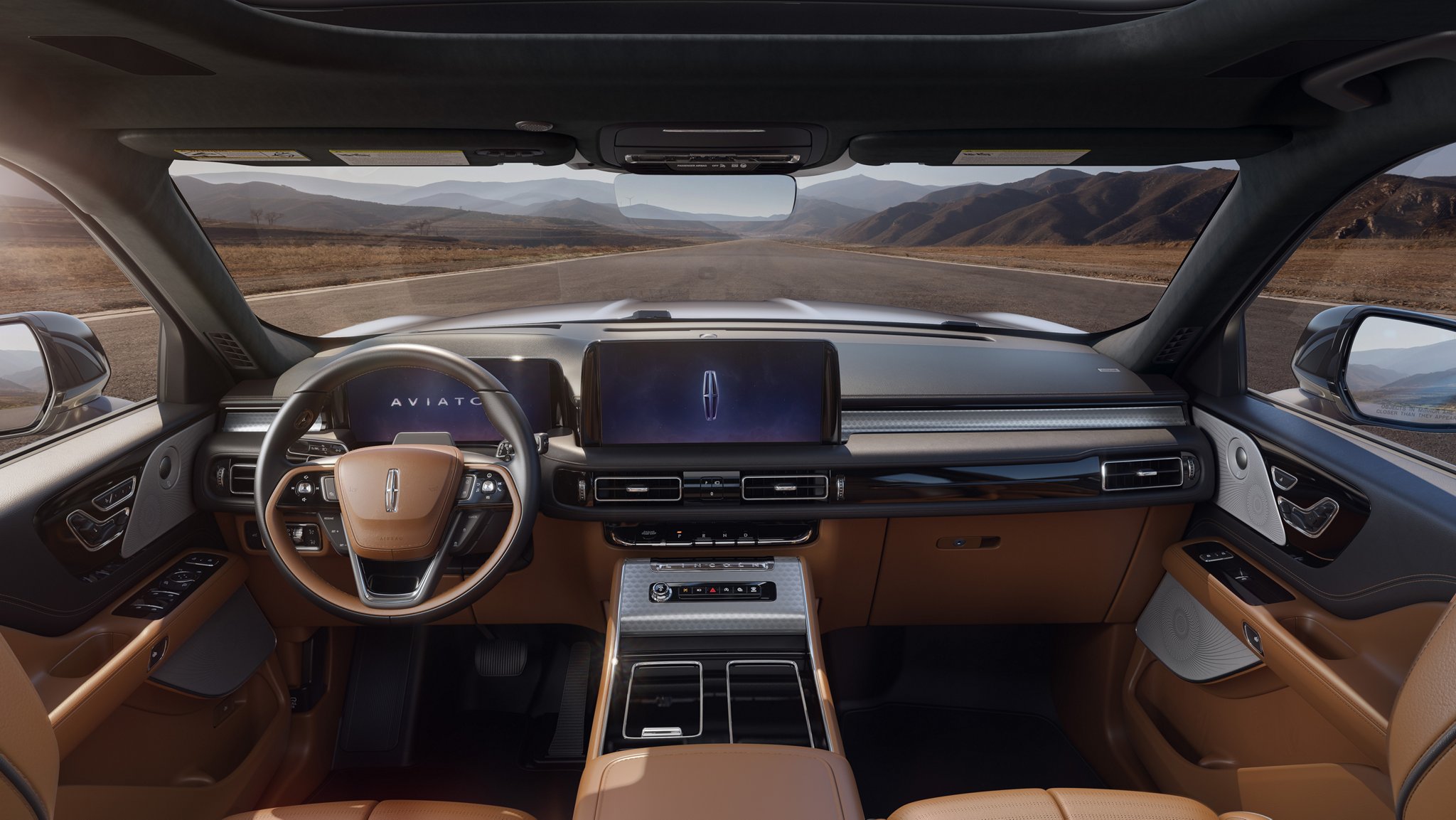 The interior of a 2025 Lincoln Black Label™ Aviator® SUV from the second row looking through the windshield