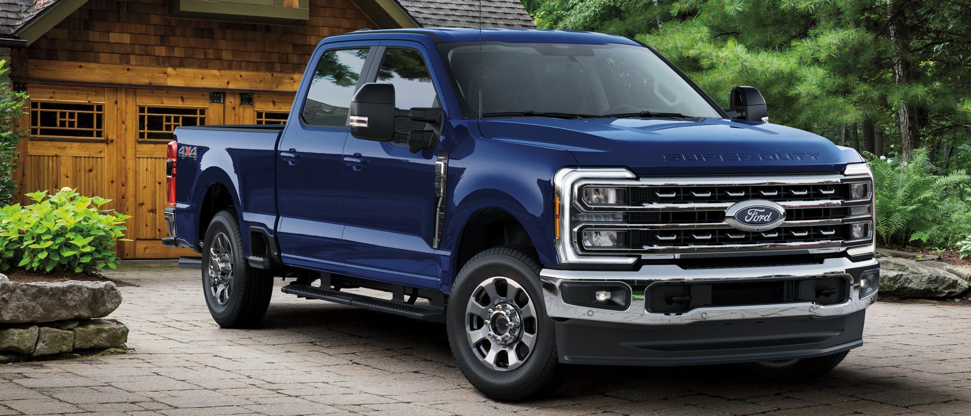 2026 Ford Super Duty® Lariat® parked in a residential driveway in front of a house