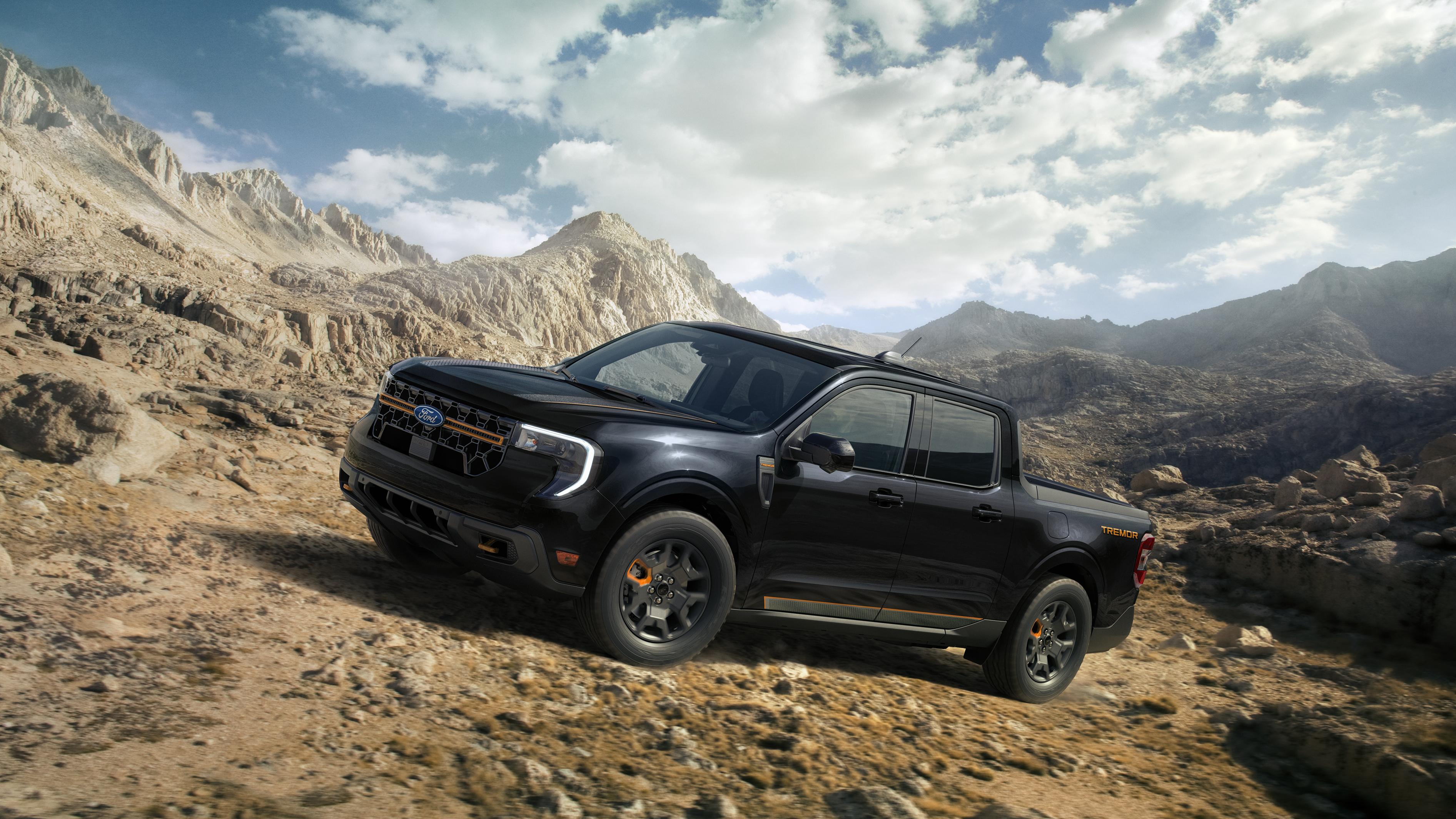 A 2026 Ford Maverick® Tremor® pickup driving up a rocky hillside