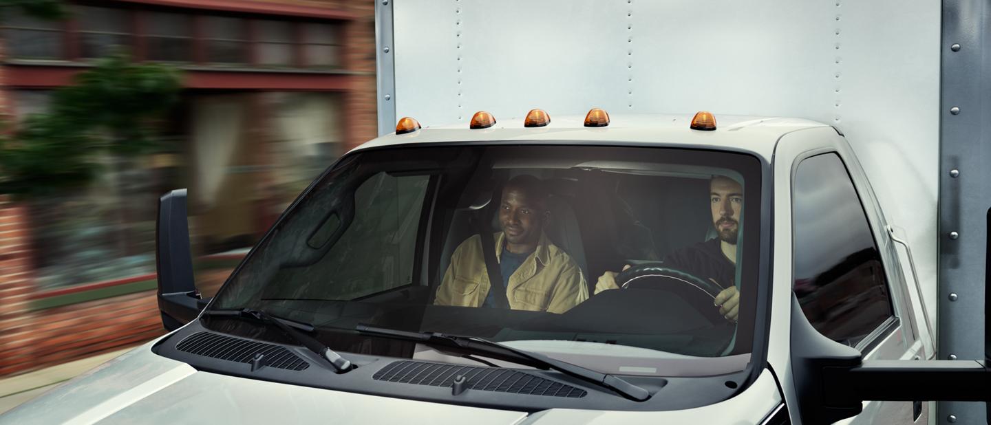 Driver and passenger seen through 2026 Ford F-750® windshield