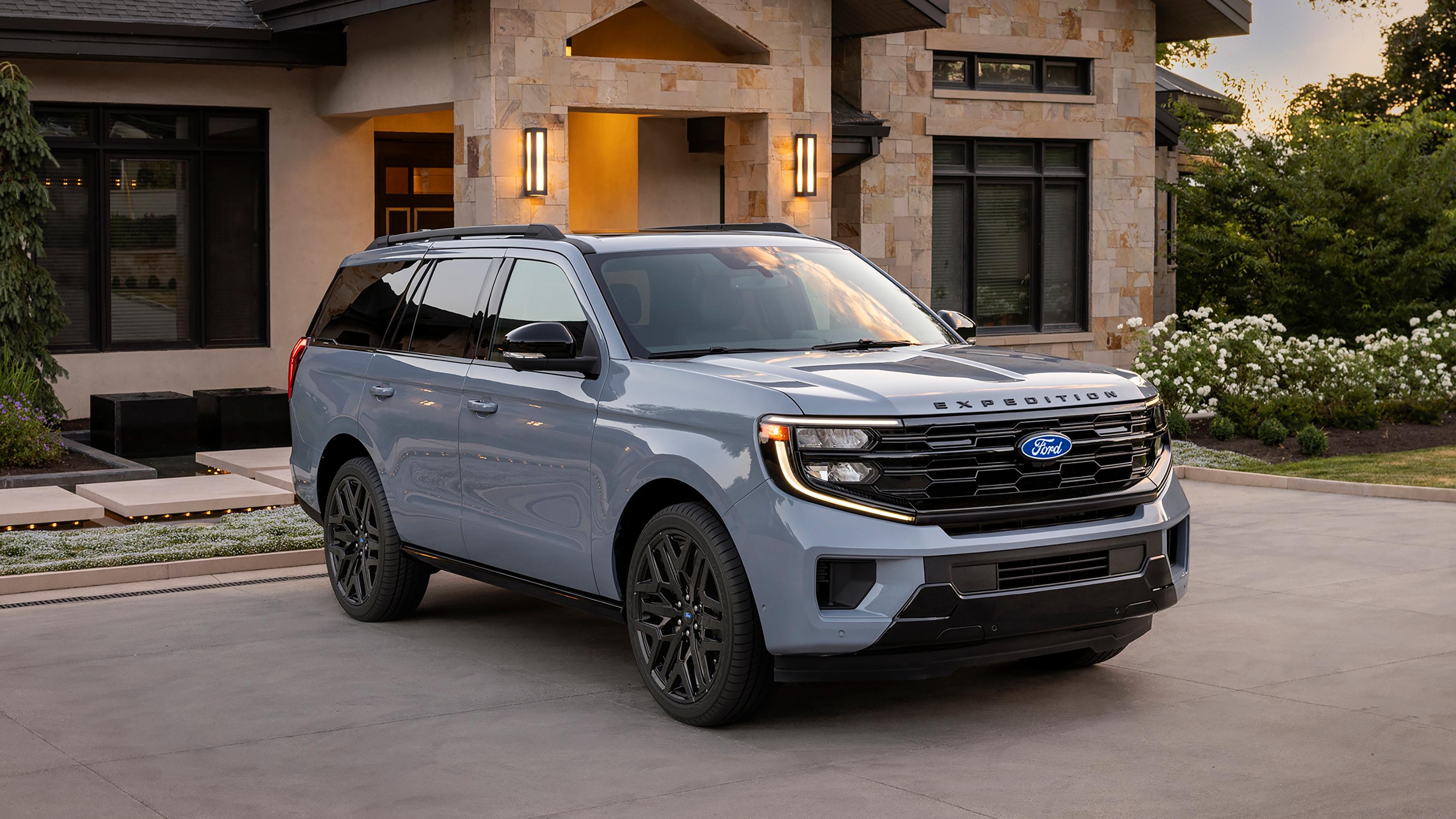 2027 Ford Expedition® Platinum® SUV with available Stealth Performance Package parked in a driveway
