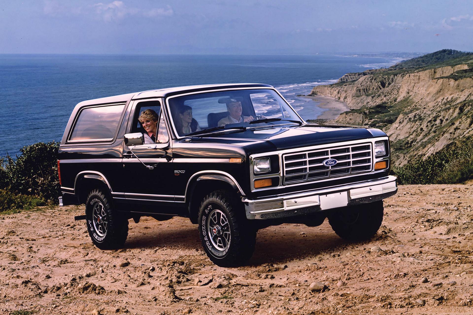 A 1983 Ford Bronco® XLT model parked on an ocean overlook