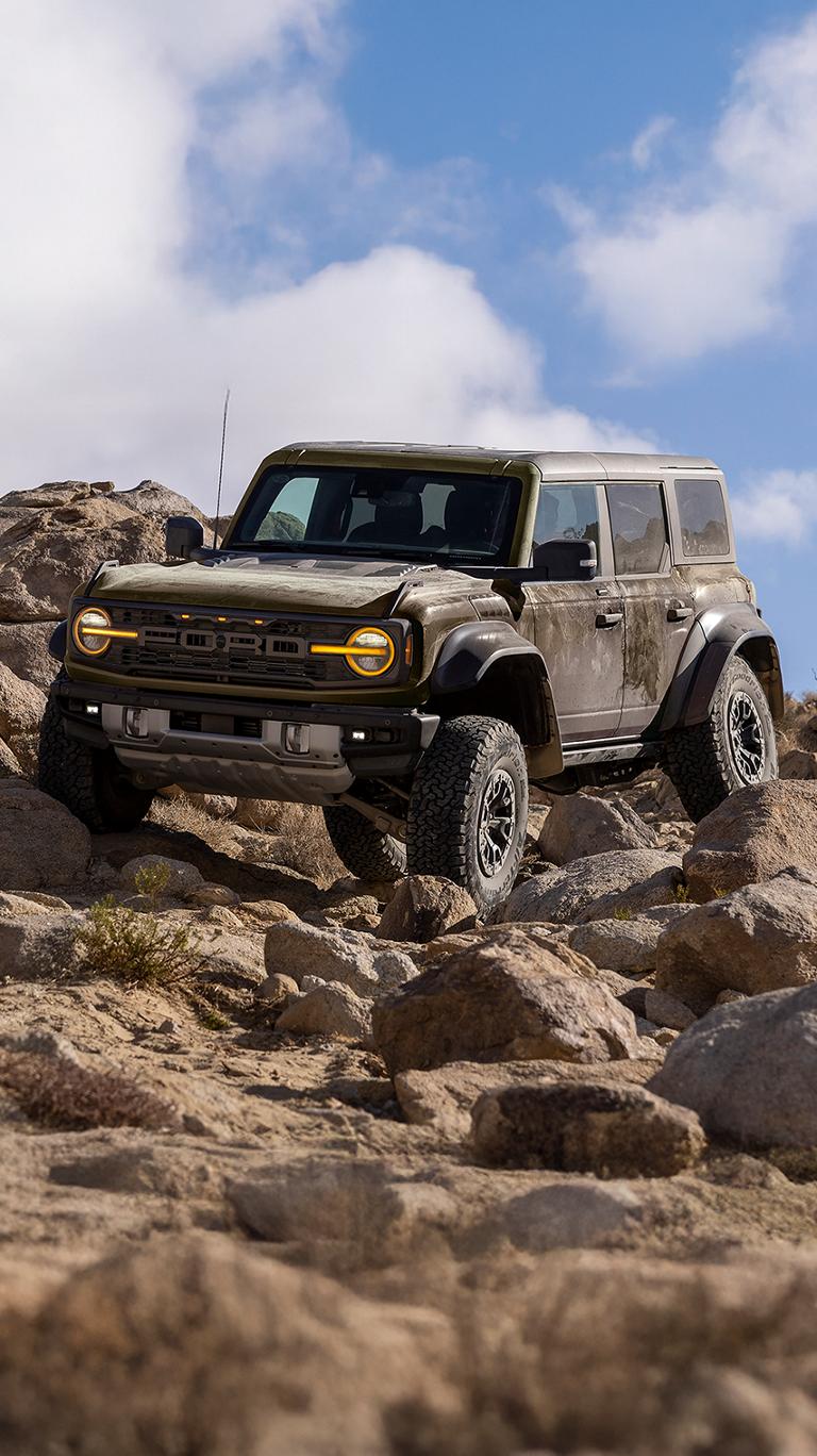 A 2026 Ford Bronco® Raptor® SUV climbing over rocks