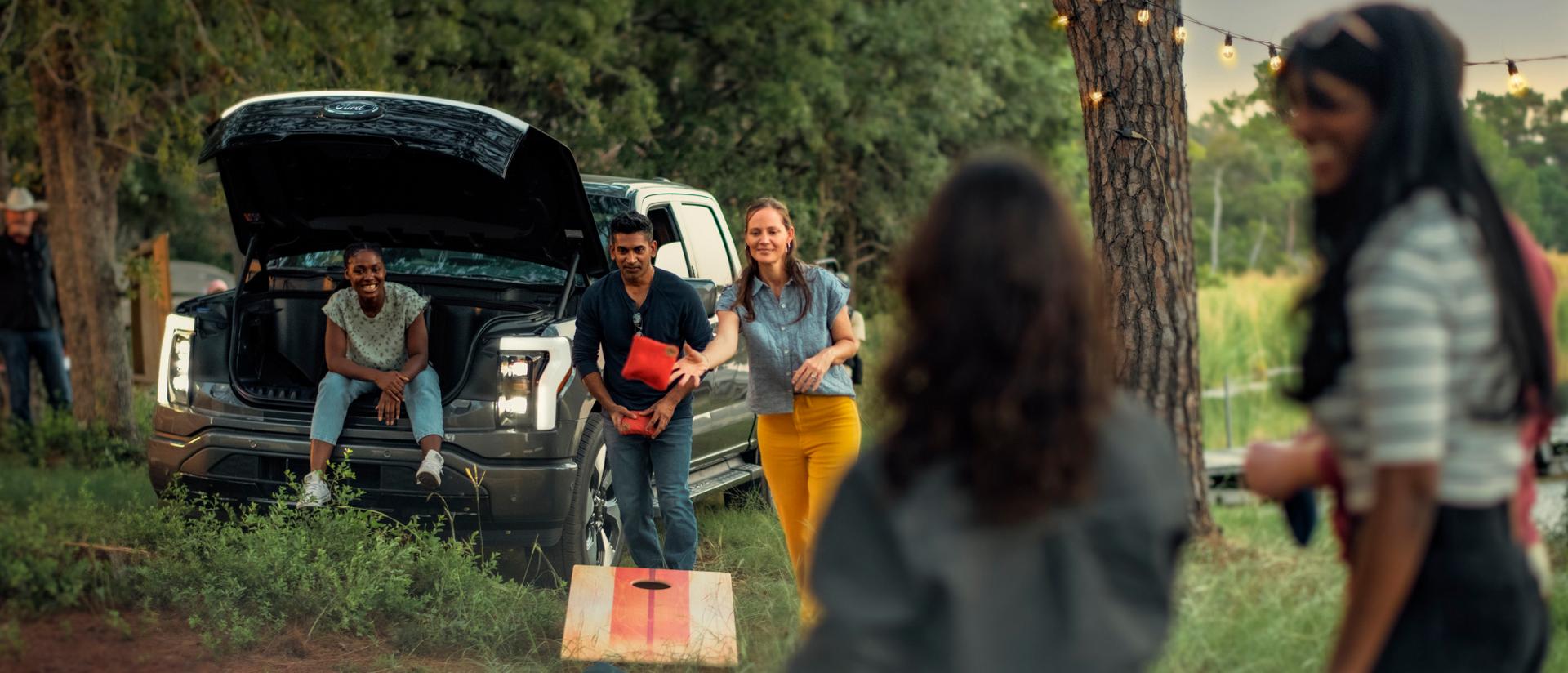 Family using their 2025 Ford F-150 Lightning truck while camping