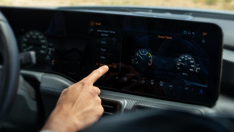 Person using the touchscreen in a 2025 Ford Mustang® model